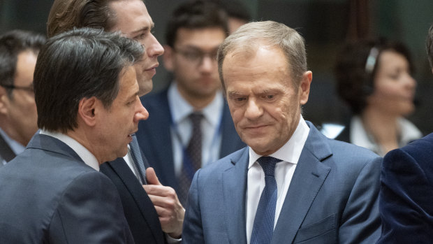 Donald Tusk, president of the European Council, centre, speaks with Italian Prime Minister Giuseppe Conte, left, at an EU leaders summit.