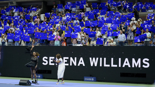 Serena Williams waves to the crowd at Arthur Ashe Stadium.