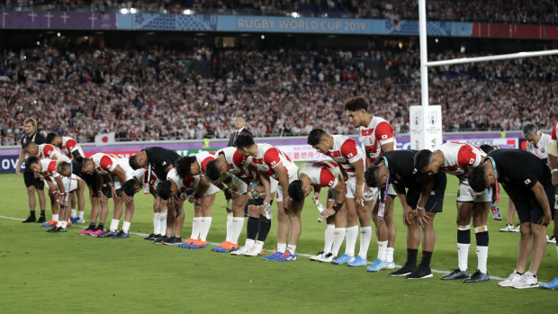 Japan players salute their fans after defeating Scotland at the 2019 World Cup.