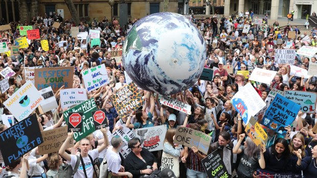 Thousands of school students attend the global climate strike rally at Town Hall in Sydney.