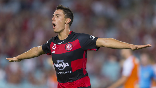 Impressive: Christopher Ikonomidis celebrates after sealing victory for the Wanderers with the third goal.