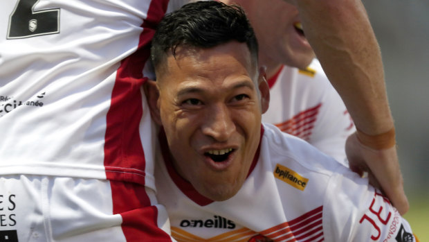 Folau celebrates his try after a lightning-fast start on debut for Catalans.