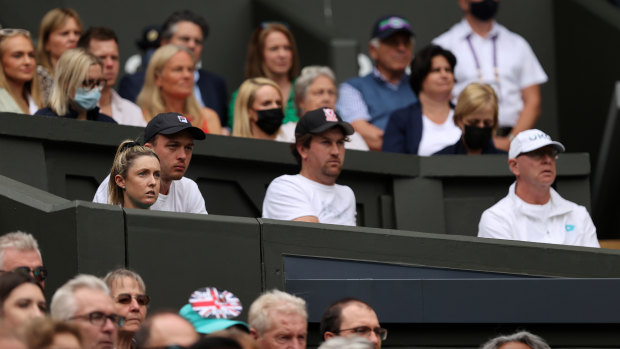 Garry Kissick (centre) watches the Wimbledon final.