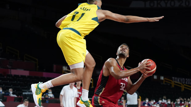 Australia’s Dante Exum (11) tries to block a shot by Germany’s Johannes Thiemann (32).