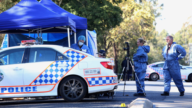 Forensic officers examine the crime scene on Blyth Road in Murrumba Downs.