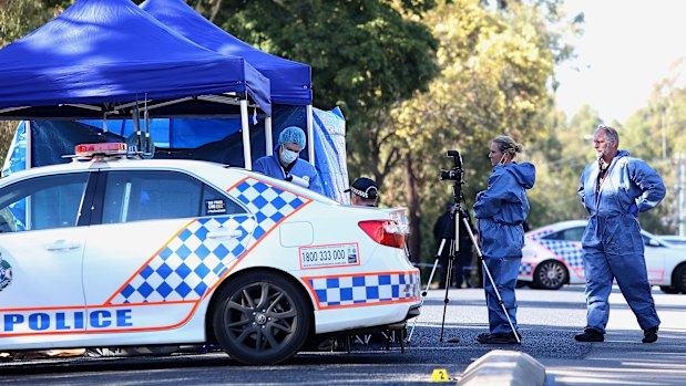 Forensic officers examine the crime scene on Blyth Road in Murrumba Downs.