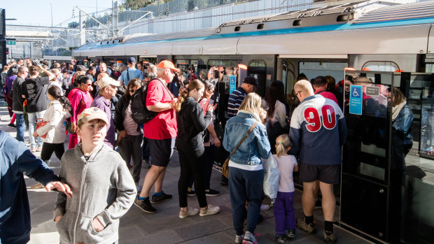 Passengers board the metro train at Tallawong Station on Sunday.