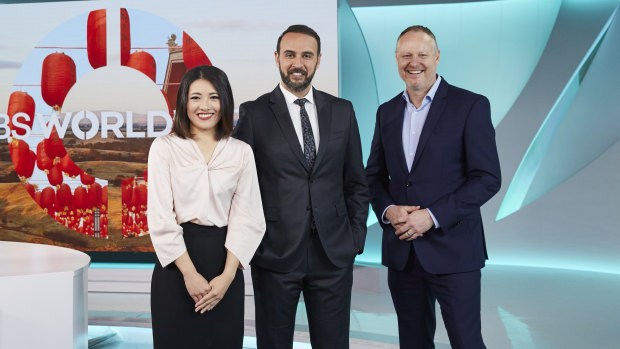 SBS newsreaders Rena Li and Ali Bahnasawy with managing director James Taylor.