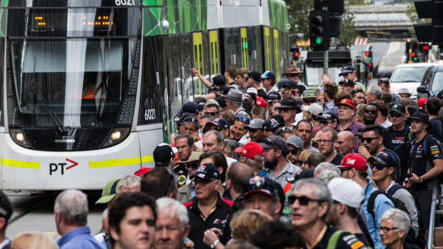 Big crowds catch trams to Albert Park for the grand prix each year.