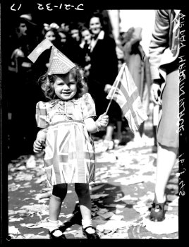 A little girl celebrates in Martin Place, Sydney on August 15, 1945.