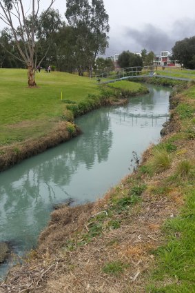 Stony Creek, at the Spotswood Golf Course, turned an unusual color as water from the firefighting efforts at the West Footscray factory blaze ran into it on Friday. 