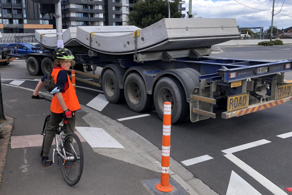 Footscray resident Scott Adams said road trains were too big for suburban streets and worried about his son Finn, pictured on Moore Street on his way to school.
