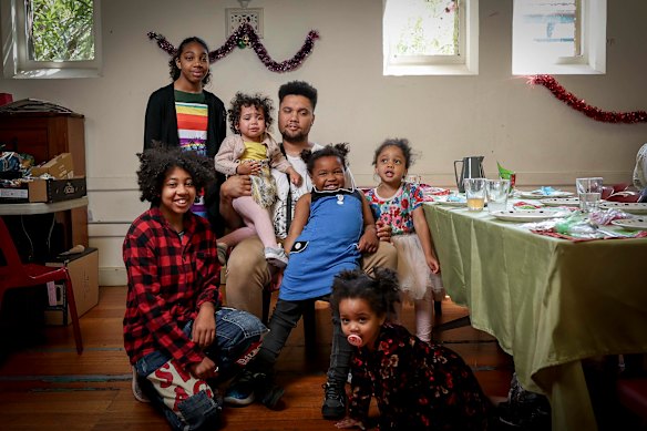 Luwayne Carries and his daughters, Skyla, 14, Sierr, 13, Amariah, 5, Zahlia, 4, Mikayah, 2, and Eliora, 1, enjoyed Christmas lunch at Kew Uniting Church.