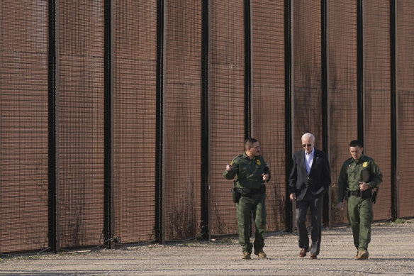  President Joe Biden walks with US Border Patrol agents along a stretch of the US-Mexico border in El Paso, Texas, in January 2023.