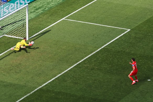 Mike Maignan saves it.