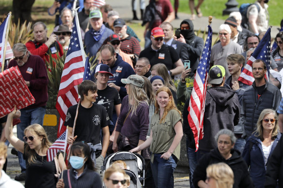 Demonstrators disregard social distancing guidelines as they crowd together at a protest in Olympia, Washington.