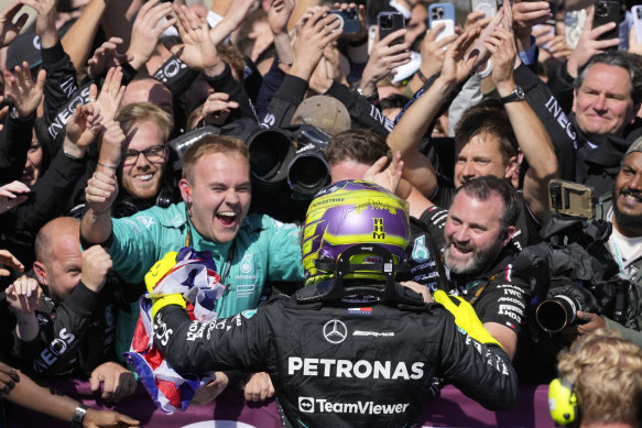 The Mercedes team celebrates Lewis Hamilton’s long-awaited win.