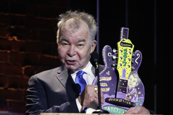 John Prine accepts the artist of the year award during the Americana Honors and Awards show in Nashville, Tennessee, in 2017.