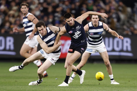 Jeremy Cameron tackles Carlton’s Nic Newman during Geelong’s win.