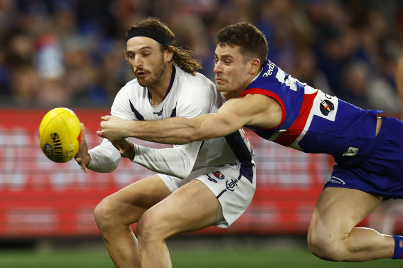 Josh Dunkley, spoiling the Docker’s James Aish in last season’s elimination final, says he prides himself ‘the tackles, smothers, spoils, getting back to help’.