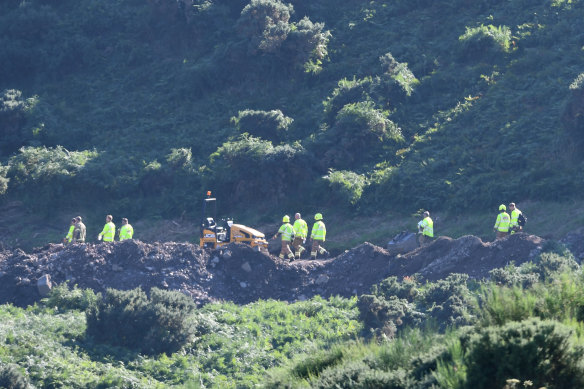 Emergency service workers at the scene of the train derailment in Scotland.