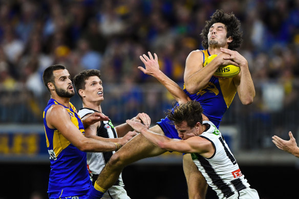 West Coast’s Tom Barrass flies for a mark.