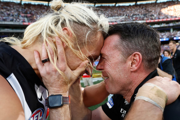 Collingwood captain Darcy Moore and coach Craig McRae in the emotional moments after the final siren.
