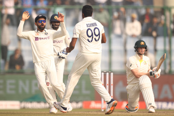 India’s Ravi Ashwin celebrates taking the wicket of Australia’s Steve Smith during a calamitous day three of the second Test in Delhi.