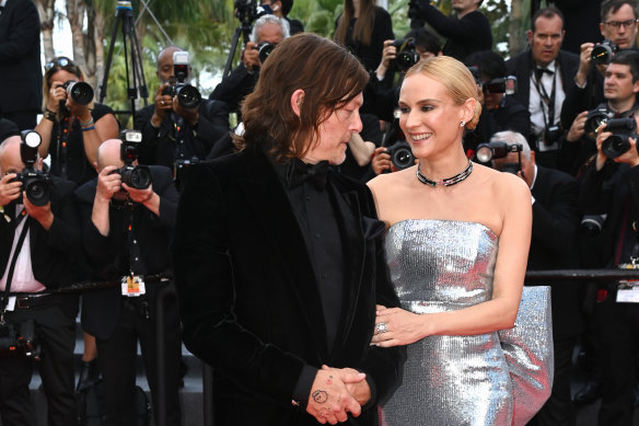 Reedus and his wife, the German actress and model Diane Kruger, walk the red carpet at Cannes in May 2022.