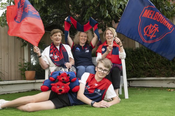 Jan Sampson (centre) with her auntie Nola Gray (left), mother Irene Lang and teenage son Cooper. They’re all members of the Demon army, and  Jan took part in the AFL Fans Association survey.