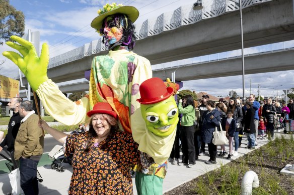 Puppeteers clasping giant figurines were among the protesters rallying to save the historic market.