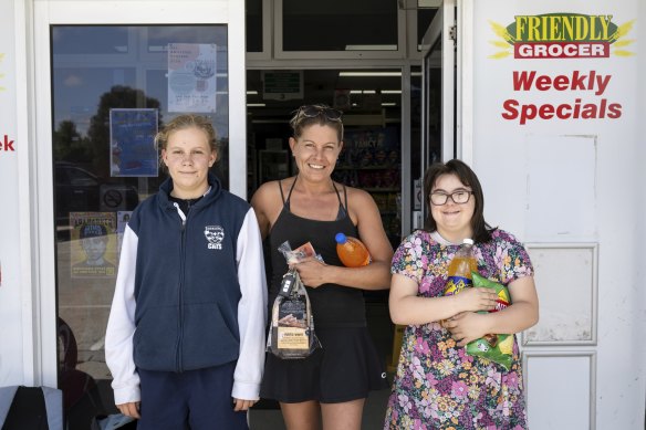 Kristy Armstrong and her daughters Mia and Phoebe at the Cape Woolamai IGA on Phillip Island. They have gas at home and a day off together so they weren’t too concerned.
