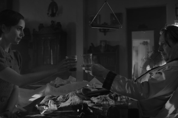 Lily Collins and Gary Oldman in Mank.
