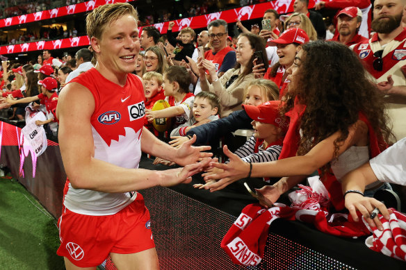 Three-goal hero Isaac Heeney celebrates with fans.