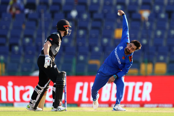 Rashid Khan bowling for Afghanistan in the T20 World Cup.