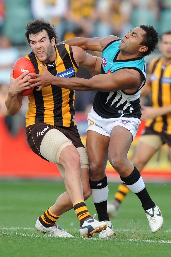 David Rodan (right) goes head-to-head with Hawthorn’s Jordan Lewis at UTAS Stadium in 2008.