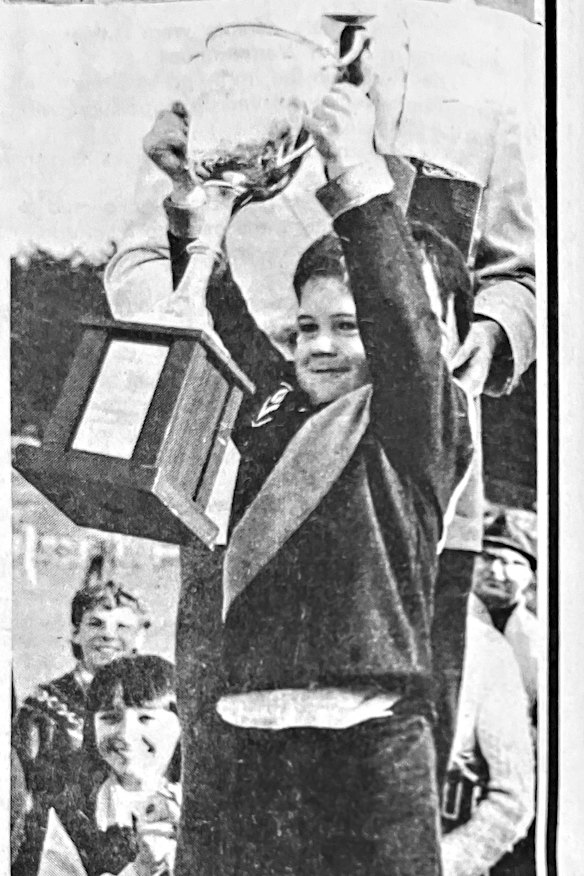 Jonathan Brown, aged 3, holds the premiership cup aloft after watching his father Brian in the 1985 Hampden Football League grand final.