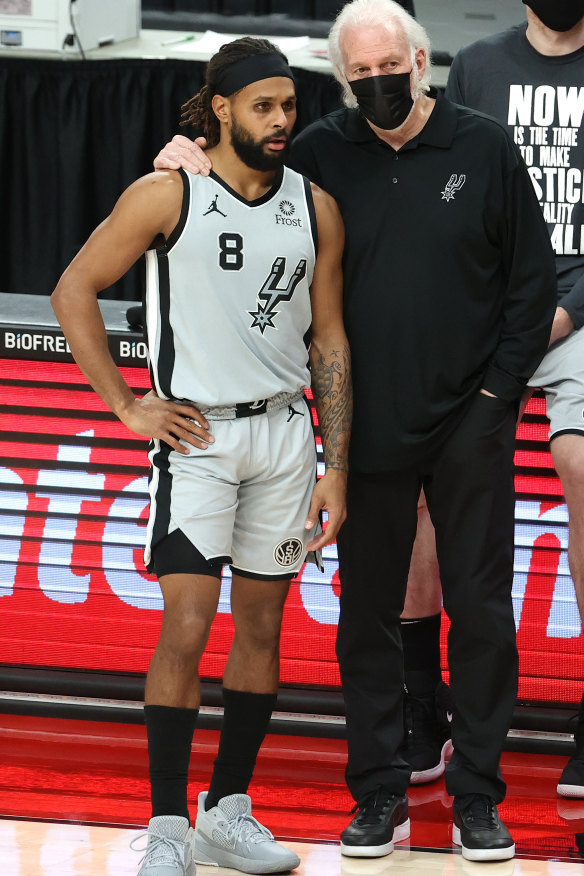 Mills with Gregg Popovich at an NBA game earlier this year. The San Antonio Spurs coach once talked about Eddie Mabo to inspire his players. 