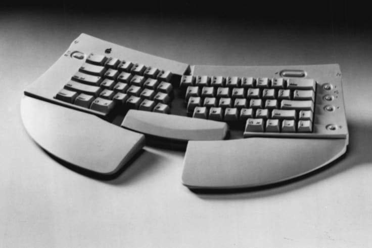 Apple's Adjustable Keyboard, 1993.  Such keyboards are said to make typing more comfortable, but the company stopped short of claiming they would help in cases of repetitive strain injury.