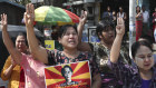 Women hold a portrait of deposed Myanmar leader Aung San Suu Kyi, during an anti-coup demonstration in Mandalay, Myanmar, Friday, March 5, 2021. Protests continue in Myanmar against the Feb 1 military coup that ousted the civilian government of Aung San Suu Kyi. Despite daily operations by police to disperse the crowds, defiant protesters continue to return to the streets in parts of the country.