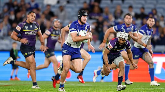 Matt Burton makes a break against Melbourne.