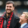 Andrew Bogut with Hawthorn great Dermott Brereton.