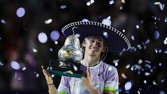 Alex de Minaur of Australia raises his trophy after defeating Tommy Paul of the United States in the final match at the Mexican Open tennis tournament in Acapulco, Mexico, Saturday, March 4, 2023. (AP Photo/Eduardo Verdugo)