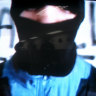 An alleged bandit of a criminal gang of Sao Paulo, Brazil, appears in a recorded message that was broadcast on O Globo television early on Sunday, Aug. 13, 2006. Brazil’s most notorious organized crime group, the PCC, kidnapped O Globo television reporter Guilherme  Portanova and forced his station to broadcast a video early Sunday in which the gang calls for improvements in the country’s prison system. (AP Photo) .