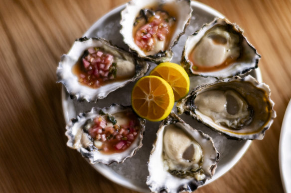 Sydney rock oysters with kalamansi, coconut water and coriander root.