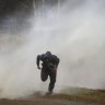 Poland uses water cannons as tensions rise at Belarus border
