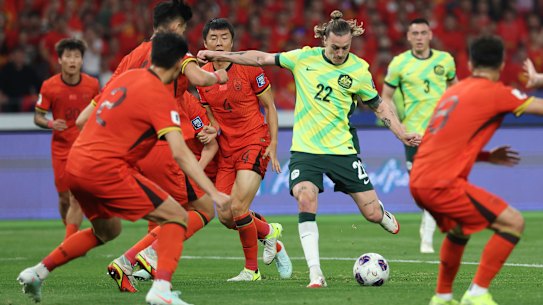 Jackson Irvine scores Australia’s first goal during their match against China in Hangzhou.