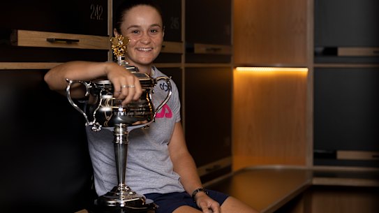 MELBOURNE, AUSTRALIA - JANUARY 29: In this handout image provided by Tennis Australia, Ashleigh Barty of Australia poses with the Daphne Akhurst Memorial Cup in the locker room after winning her Women’s Singles Final match against Danielle Collins of United States during day 13 of the 2022 Australian Open at Melbourne Park on January 29, 2022 in Melbourne, Australia. (Photo by Fiona Hamilton/Tennis Australia via Getty Images)