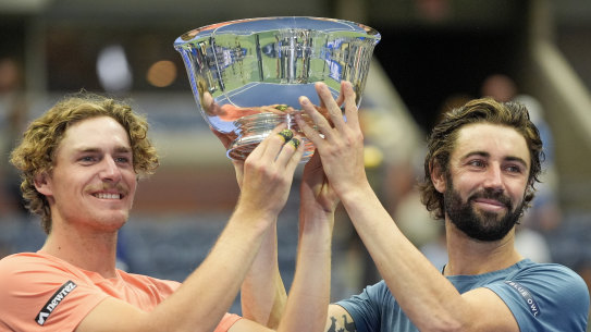 Max Purcell, left, and Jordan Thompson hold up the championship trophy.