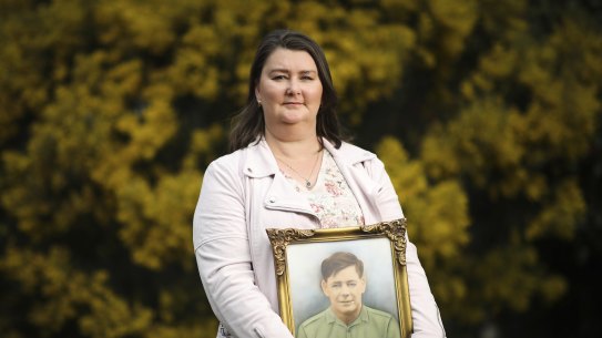 Jenni Rickard, of the Australian Parents Council, with a photo of her soldier grandfather